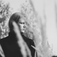 Illustrative portrait, not the reviewer. Hamed Hoseini Pur / Unsplash.