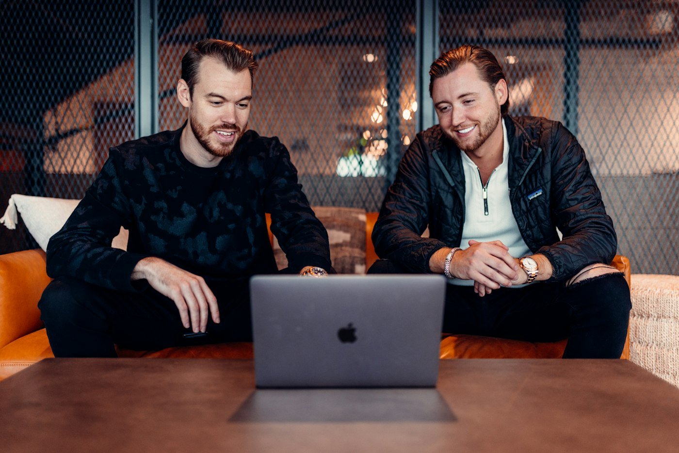 Two founders working together on a laptop