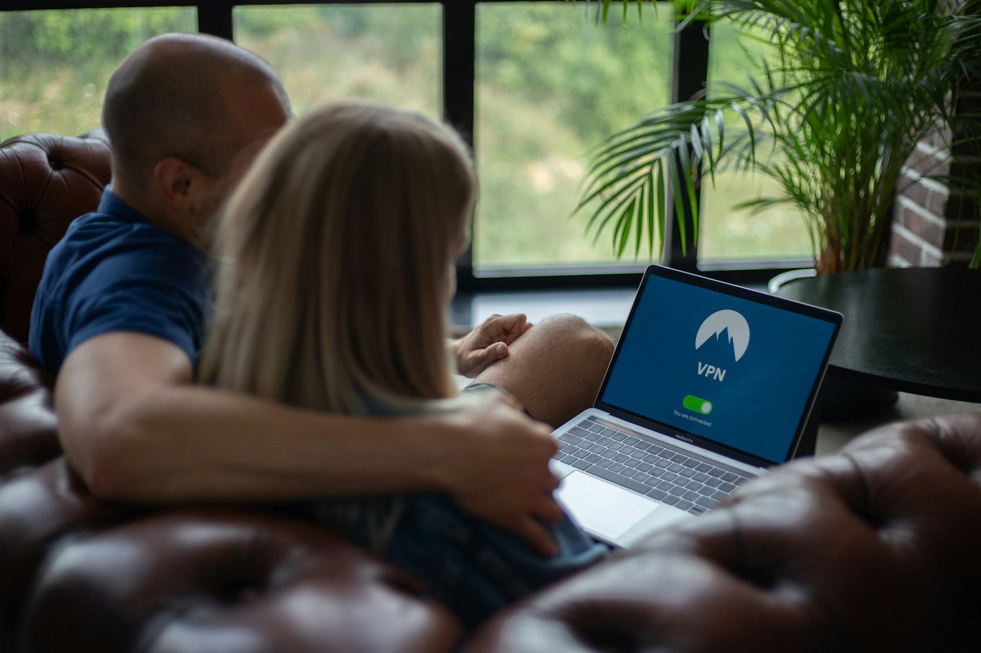 Person browsing on a laptop at home